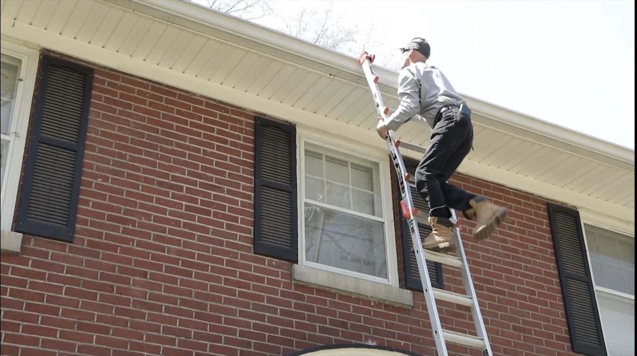 John on ladder